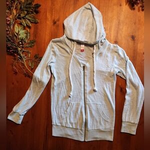 Light blue women's jacket with zipper and cute ties, size Medium